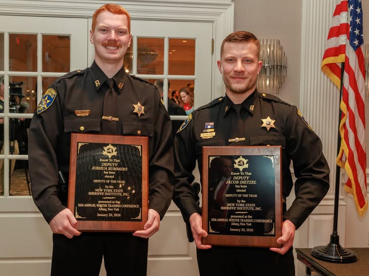 Chautauqua County Sheriff’s Office — Deputy Joshua Summers (above left) and Deputy Jacob Dietzel pose with their plaques following recognition on the dais.